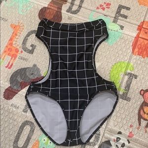 Unique one piece bathing suit with side cutouts